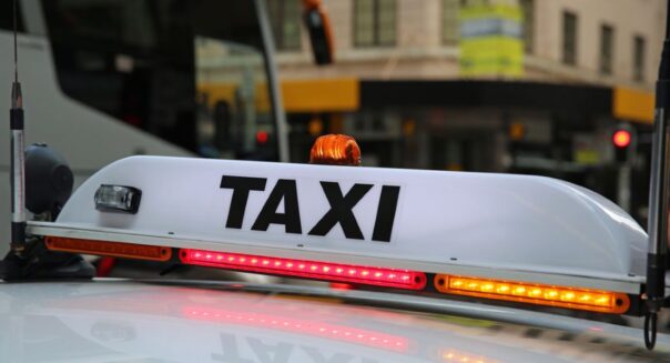 Taxi teken in Sydney op de auto